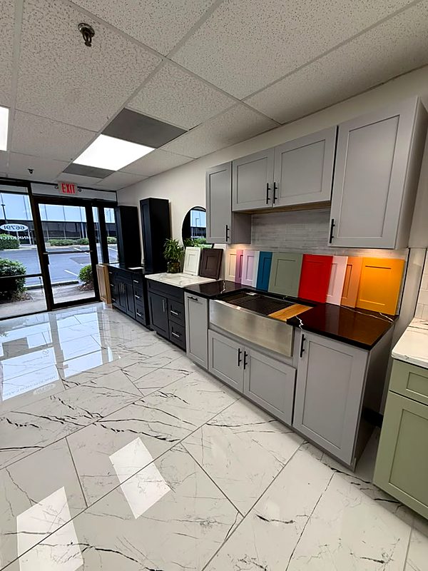 Gray Shaker display cabinets with painted door samples in the Cabinet Bazaar showroom